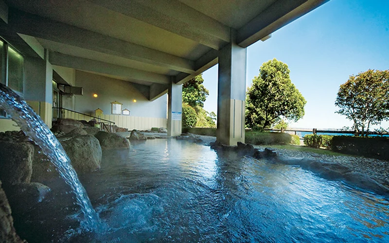 Sunrise open-air bath over the bay at Grand Mercure Beppu Bay Resort & Spa in Hiji, near Beppu onsen, Japan