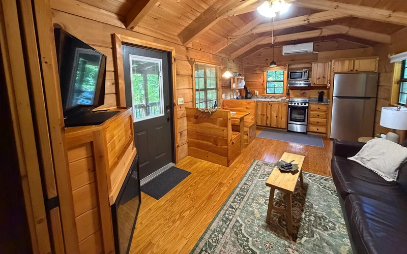 Log cabins with private porch hot tubs on NC-209 south of the hot springs in Hot Springs, North Carolina