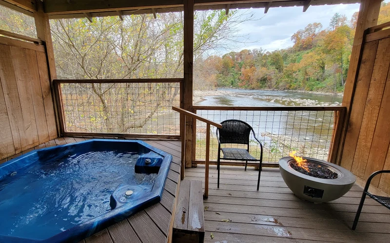 Riverside private mineral tubs and the Swiss-style lodge at Hot Springs Resort & Spa, the only public hot springs in Hot Springs, North Carolina