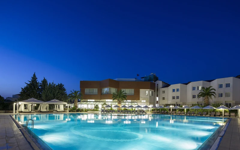 Outdoor pool and grounds at Richmond Pamukkale Thermal Resort, a thermal base for the Pamukkale hot springs