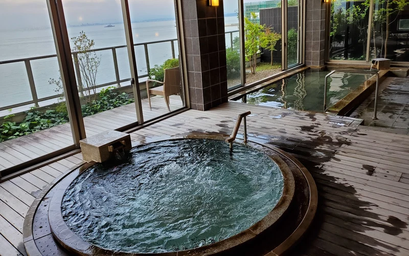 Private terrace open-air bath facing Beppu Bay at AMANE RESORT SEIKAI, Beppu onsen, Oita, Japan