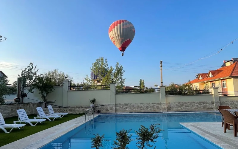 Guest room and pool terrace at Sirius Otel Pamukkale, an adults-leaning base for the Pamukkale hot springs
