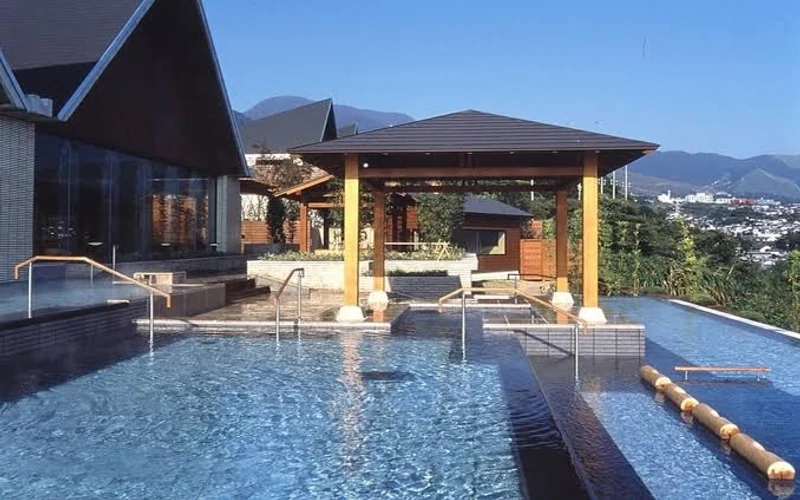 Terraced Tanayu open-air baths overlooking Beppu Bay at Suginoi Hotel, Kankaiji, Beppu onsen, Japan