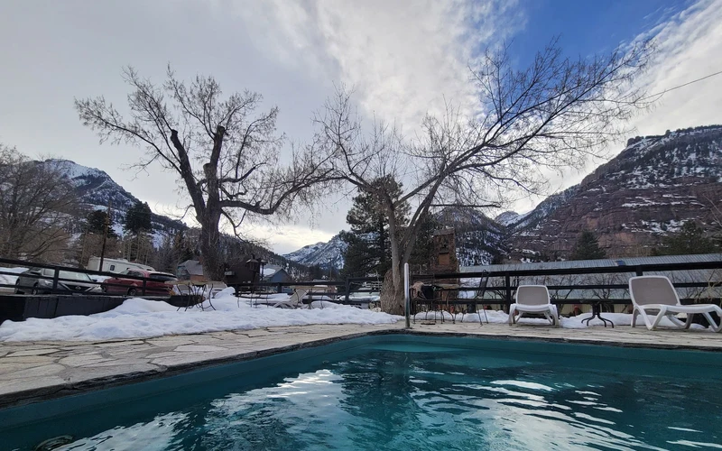 Outdoor mineral pool and vapor cave entrance at the Wiesbaden, a hot springs hotel in Ouray, Colorado